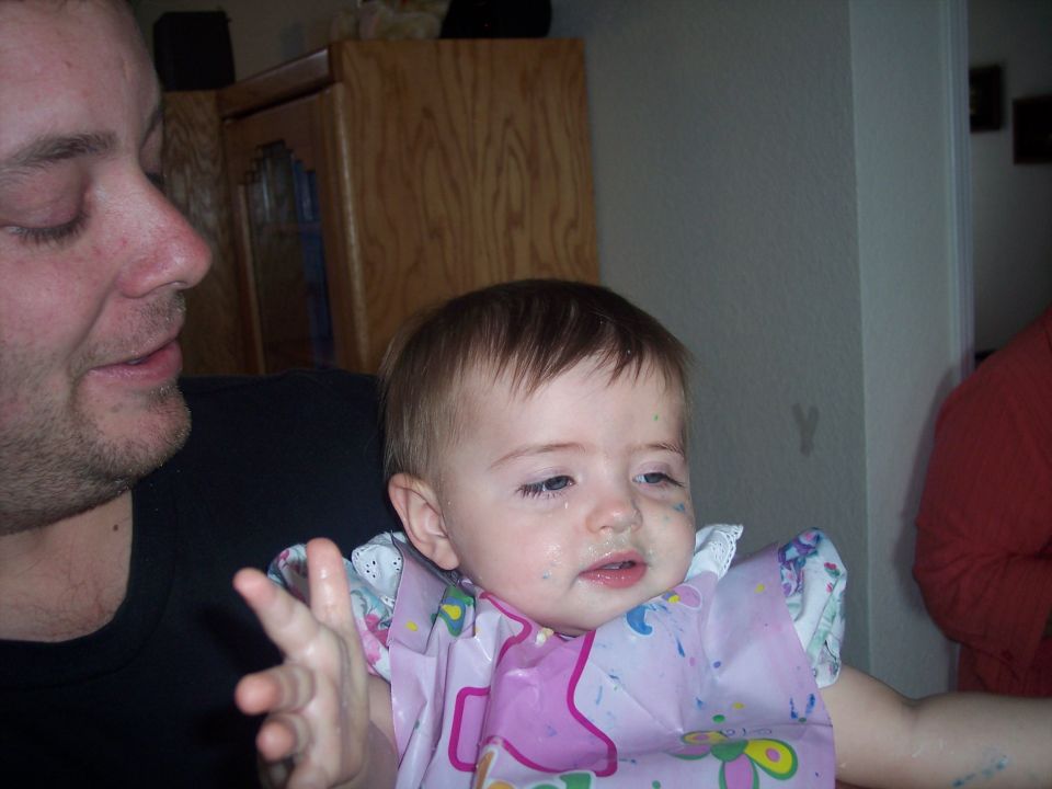 Baby with father, messy face and bib