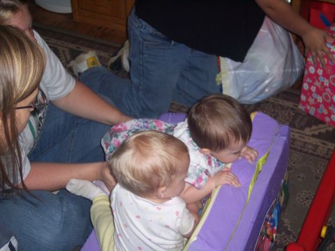1972 Ford Ranchero - Babies are playing with a toy while adults supervise.