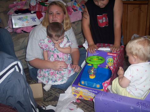 1972 Ford Ranchero - Family gathers to open gifts, including a new toy ride-on car for the children.