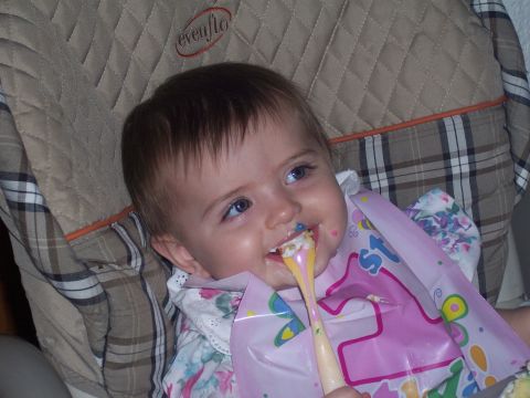 1972 Ford Ranchero - A baby is being fed with a spoon while sitting in a high chair.