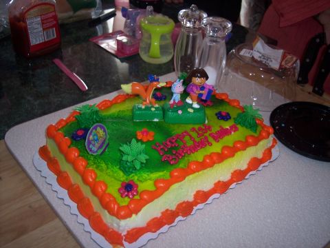 1972 Ford Ranchero - A birthday cake decorated with Dora the Explorer figures and the message 'Happy 1st Birthday Darian'.