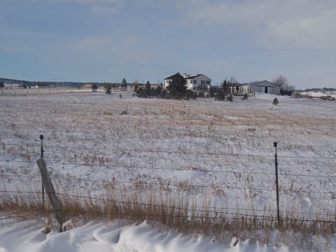 1972 Ford Ranchero - Farm buildings are visible across a snow-covered field.