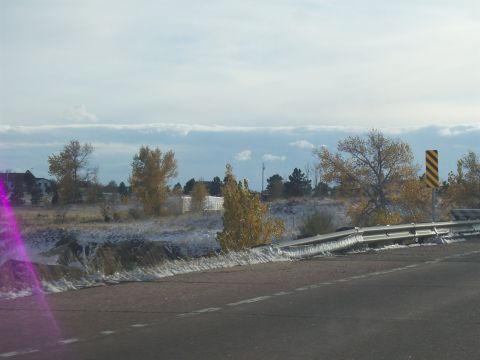 1972 Ford Ranchero - A roadside view shows patchy snow on the ground and trees with autumn leaves under a cloudy sky.