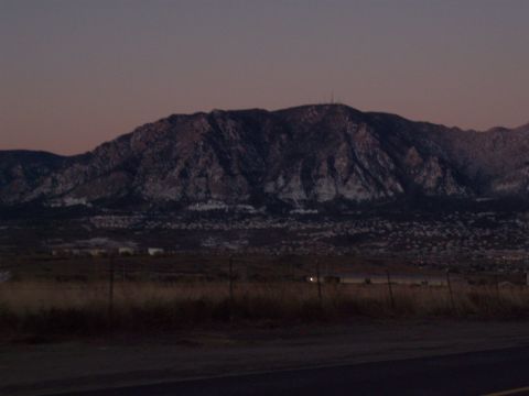 1972 Ford Ranchero - A mountain range is visible in the distance, dusted with snow, under a twilight sky.