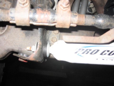 2001 Ford F-150 - Close-up view of vehicle suspension components, including a Pro Comp shock absorber.