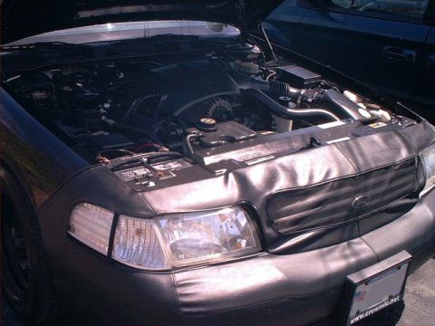 2000 Ford Crown Victoria - The engine bay of a 2000 Ford Crown Victoria is visible, with the hood open.