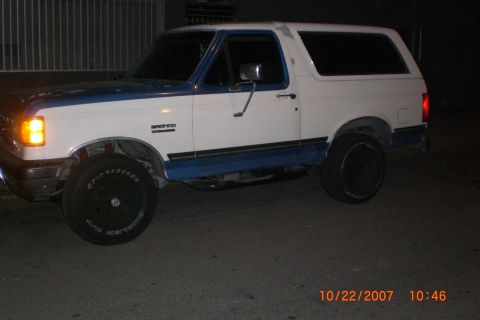 1991 Ford Bronco - This 1991 Ford Bronco features a two-tone white and blue paint scheme and appears to be in good condition.