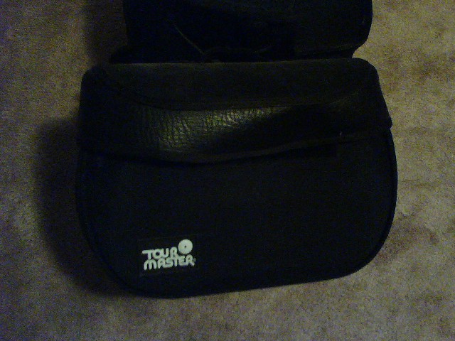 Black Tour Master saddlebag with textured leather flap