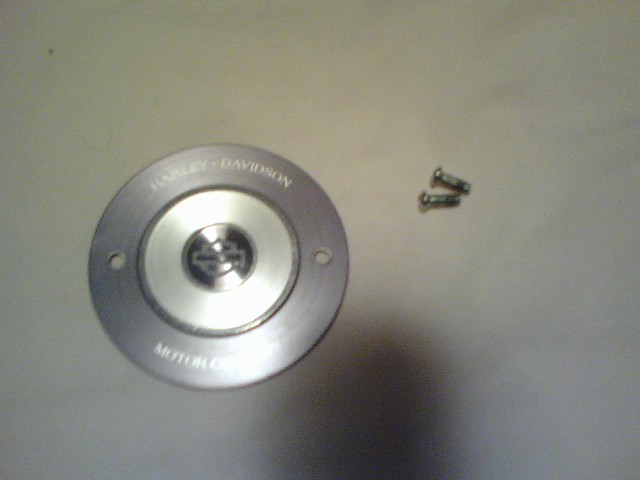 Silver Harley-Davidson gas cap with screws