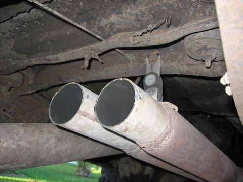 1979 Ford F-150 - Underside view of dual exhaust pipes and chassis components.