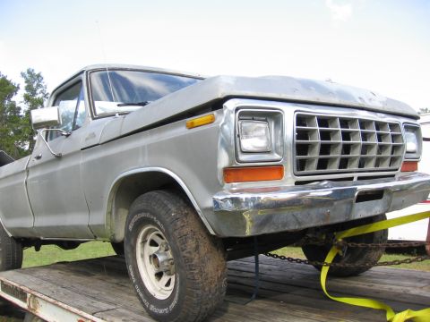 1979 Ford F-150 - This 1979 Ford F-150 pickup truck is shown from the front quarter angle while on a trailer.
