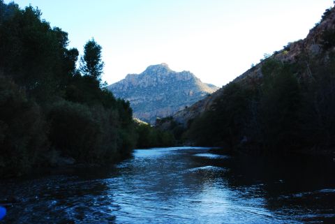 1997 Ford F-250 - A scenic view of a river winding through a canyon, with a mountain dominating the horizon.