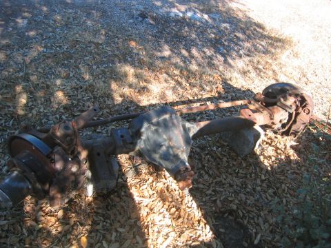 1973 Ford F-100 - This is a Ford Dana 60 rear axle assembly, likely from a truck, resting on the ground.