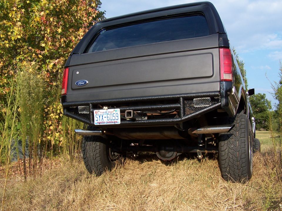 Dark gray Ford Bronco rear with custom bumper and license plate SYX-6059