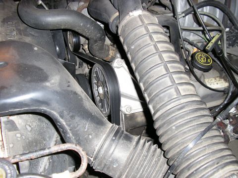 1996 Ford Bronco - Engine bay detail with air intake hose, belts, and pulleys visible.