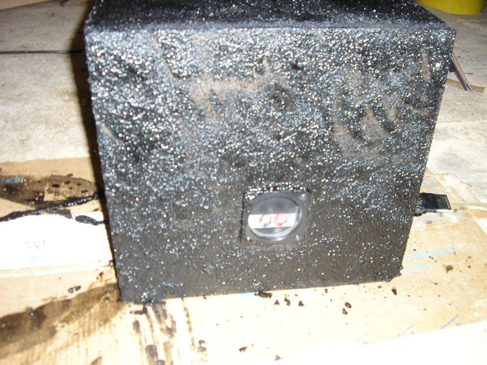 Subwoofer box coated in textured black bedliner with speaker terminal cup