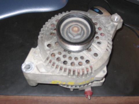 2001 Ford F-150 - A close-up view of a vehicle alternator, a critical component for electrical systems.