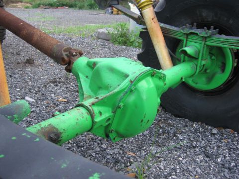1979 Ford F-150 - This photo shows a close-up of a vehicle's rear differential and driveshaft, painted bright green.