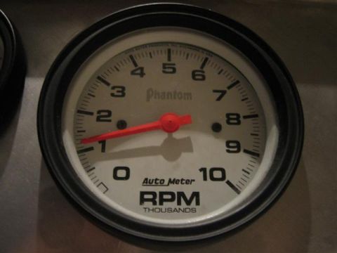 1900 Yugo Vega - This is a close-up view of an Auto Meter Phantom RPM tachometer.
