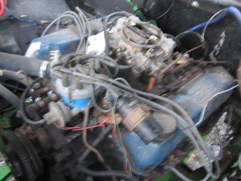 1979 Ford F-150 - Engine bay detail showing a Ford V8 motor with blue valve covers and associated wiring.