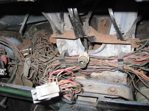 1979 Ford F-150 - A complex and messy wiring harness is visible under the dashboard, likely requiring attention.