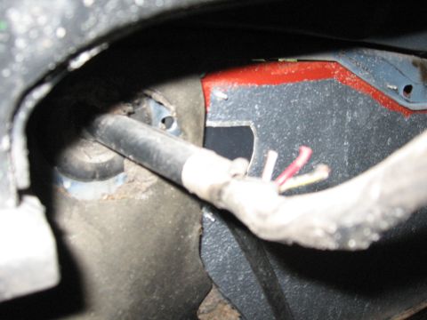 1979 Ford F-150 - Close-up view of a wiring harness and metal frame on a 1979 Ford F-150.