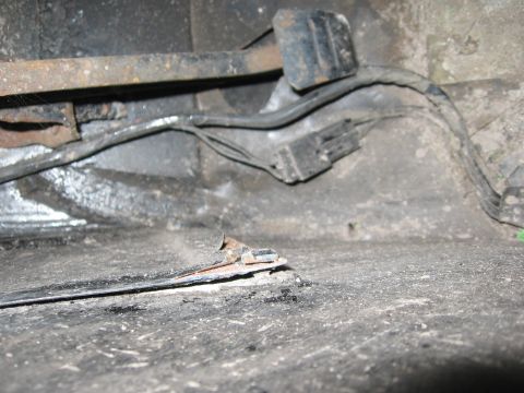 1979 Ford F-150 - Wiring harness and frame components visible in a vehicle's undercarriage.