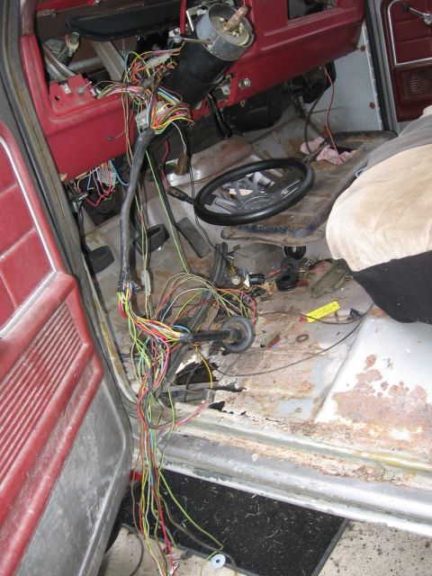 1979 Ford F-150 - The interior of a 1979 Ford F-150 shows extensive exposed wiring and a disassembled dashboard.