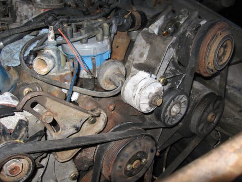 1979 Ford F-150 - Close-up view of engine components including belts and pulleys.