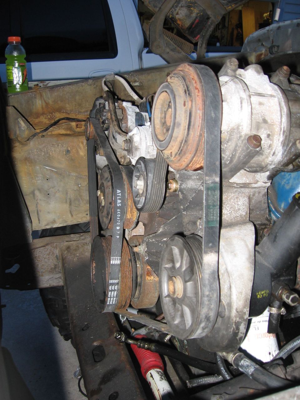 Engine accessory drive with ATLAS serpentine belt, pulleys and A/C compressor