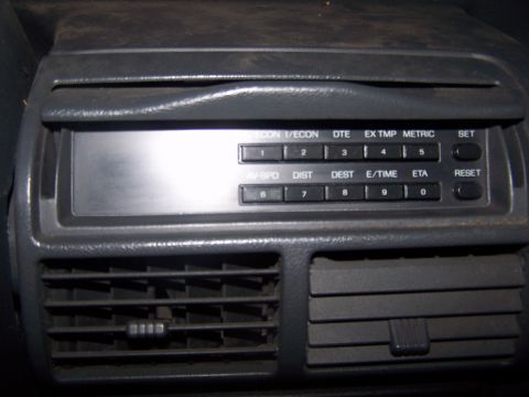 1994 Ford Probe - Close-up of a car's climate control panel, showing buttons and vents.