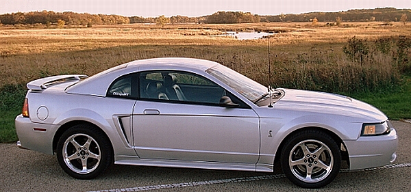 Silver coupe with a spoiler and side scoop