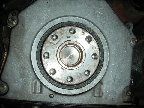 1992 Ford Crown Victoria - Engine crankshaft seal housing with Ford logo visible, likely a transmission component.