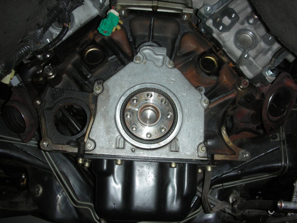 Close-up of a car's engine bell housing and oil pan