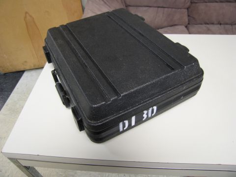 1991 Ford LTD Crown Victoria - A black carrying case with 'DI 3D' marked on its side sits on a white table.