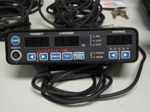 1991 Ford LTD Crown Victoria - A Genesis radar detector unit is shown with its power cord and a set of keys in the background.