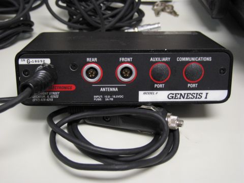1991 Ford LTD Crown Victoria - Photo of a Genesis I (Beltronics) detector control module rear panel showing rear/front antenna ports, auxiliary and communications ports;…