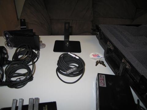 1991 Ford LTD Crown Victoria - Various audio equipment, including coiled cables and microphone stands, are laid out on a table.
