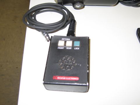 1991 Ford LTD Crown Victoria - A close-up view of a Decatur Electronics radar control unit, buttons for antenna, front, rear, and lock functions.