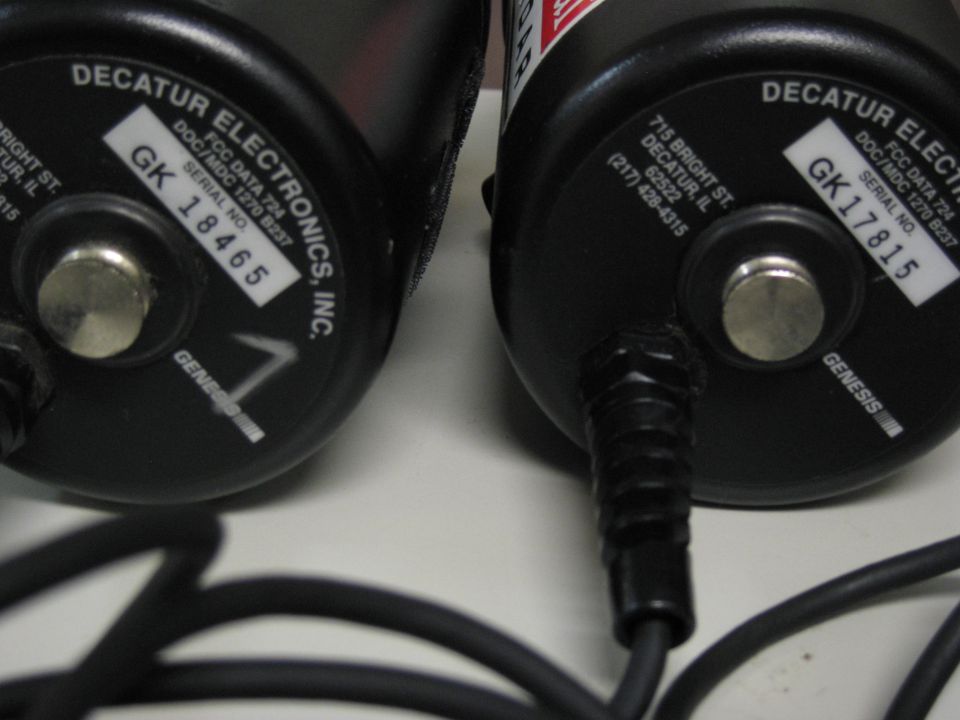 Two black Decatur Electronics radar units with serial numbers GK 18465 and GK 17815 visible