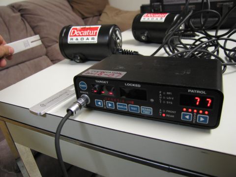 1991 Ford LTD Crown Victoria - Radar detection equipment including sensors and a control unit is set up on a table.