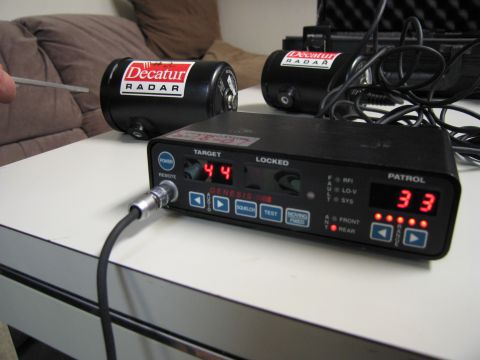 1991 Ford LTD Crown Victoria - A close-up of police radar equipment, including two radar antennas and a control unit.