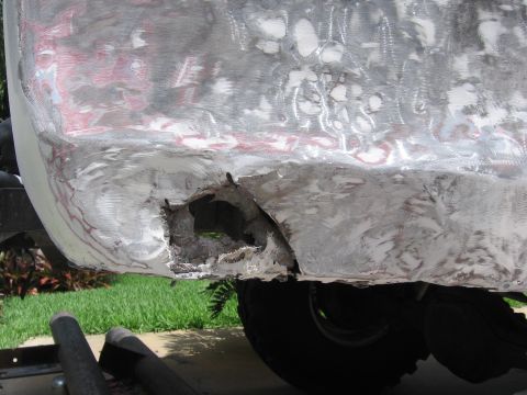1979 Ford F-150 - This vehicle body panel displays significant rust and damage, requiring extensive repair.