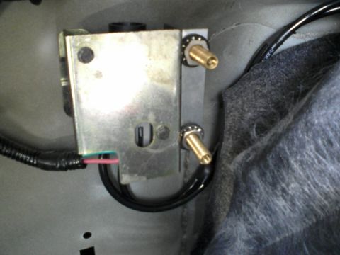1996 Mercury Grand Marquis - I riveted a small bracket to the fuel inertia switch bracket to mount the two schrader valves