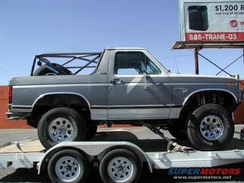 1984 Ford Bronco - This modified Ford Bronco, likely from the early 1980s, is loaded onto a trailer.