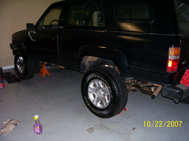 Black 1987 Toyota 4Runner side view on jack stands