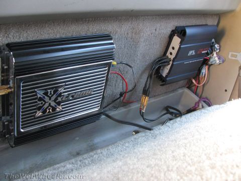 1994 Chevrolet Silverado 3500 - Two car audio amplifiers, one labeled 'Xtreme', are installed in the interior of a vehicle.