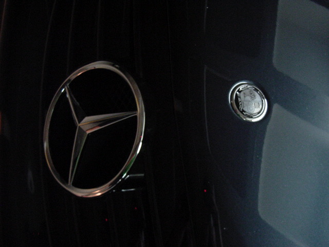 Close-up of a Mercedes-Benz grille with a star emblem and an AMG badge