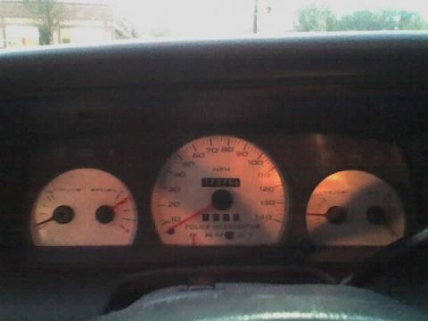 2001 Ford Crown Victoria - The dashboard of a 2001 Ford Crown Victoria displays the speedometer, fuel, and temperature gauges.