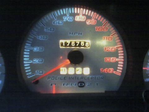 2001 Ford Crown Victoria - The gauge cluster displays "POLICE INTERCEPTOR" and a mileage reading of 176,766.